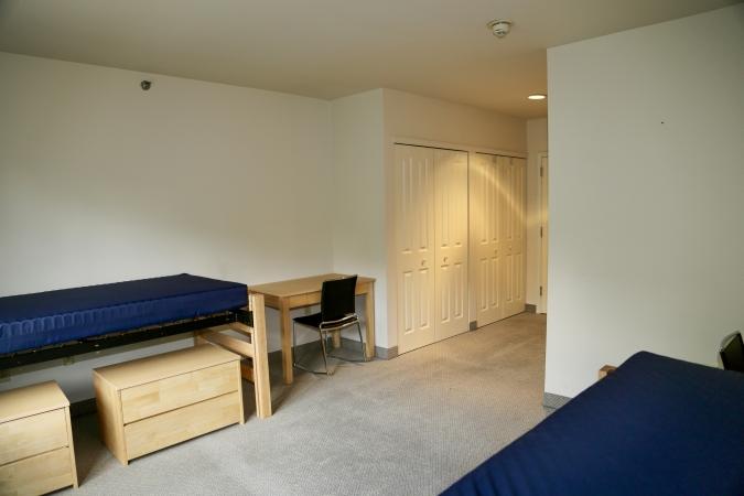 Delaney Hall Residence dorm room showing beds and closets